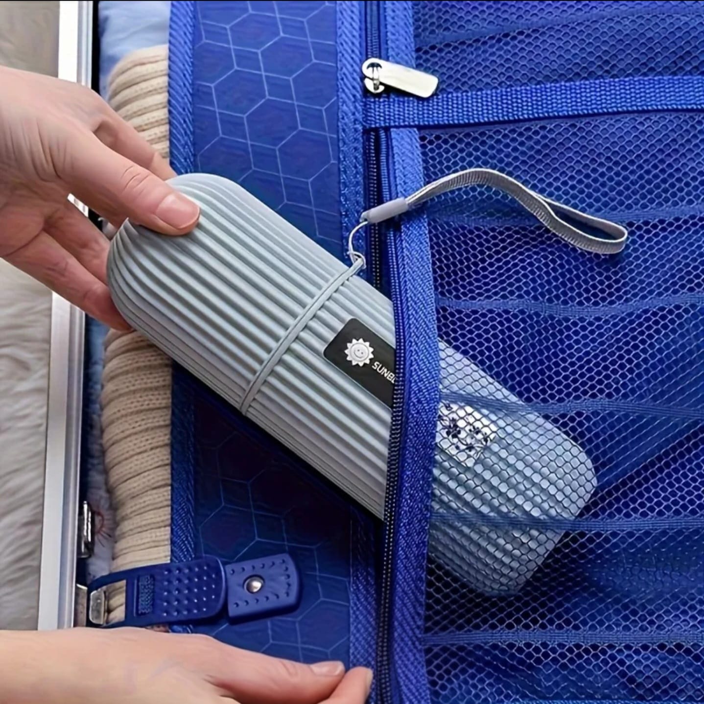 Portable toothbrush travel case placed inside a travel bag, compact and hygienic design