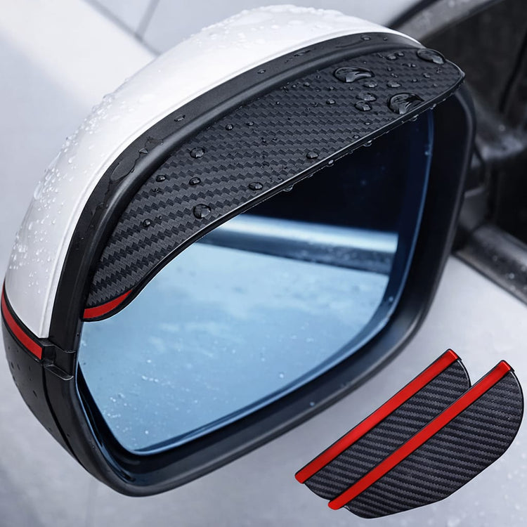Car side mirror rain visor with carbon style finish, waterproof guard installed on vehicle mirror with water droplets visible