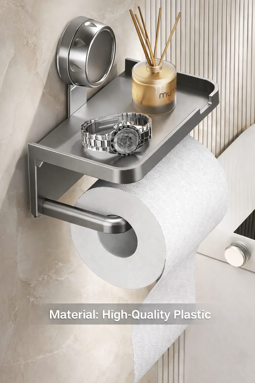 Luxury wall-mounted toilet paper holder with storage shelf, holding a watch and diffuser, no-drill bathroom accessory in grey finish